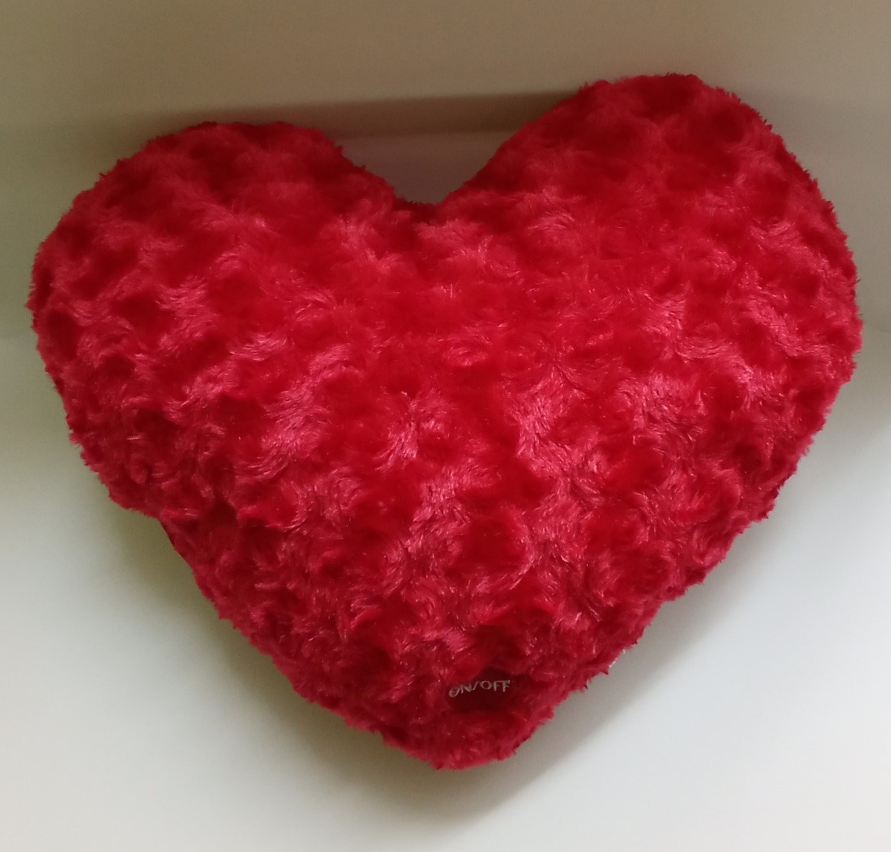 Cojín corazón de peluche con luz
